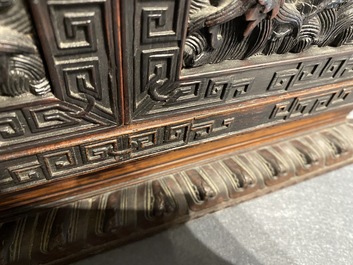 Un petit cabinet en bois sculpt&eacute; &agrave; d&eacute;cor de dragons, Chine, R&eacute;publique